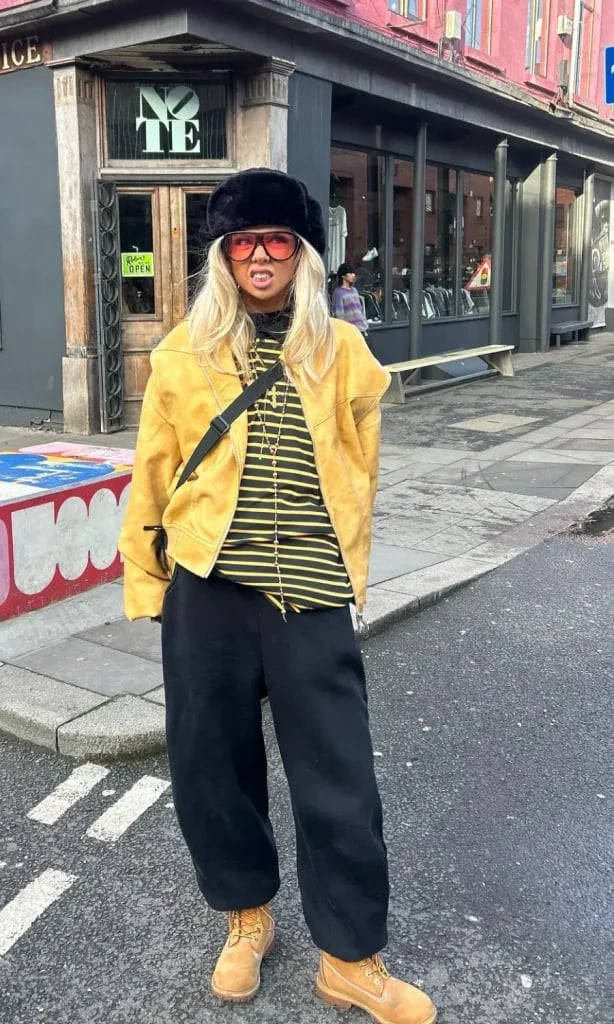 Black Sweatpants With Yellow Suede Jacket and Timberland Boots — Cute Sweatpants Outfit Inspo