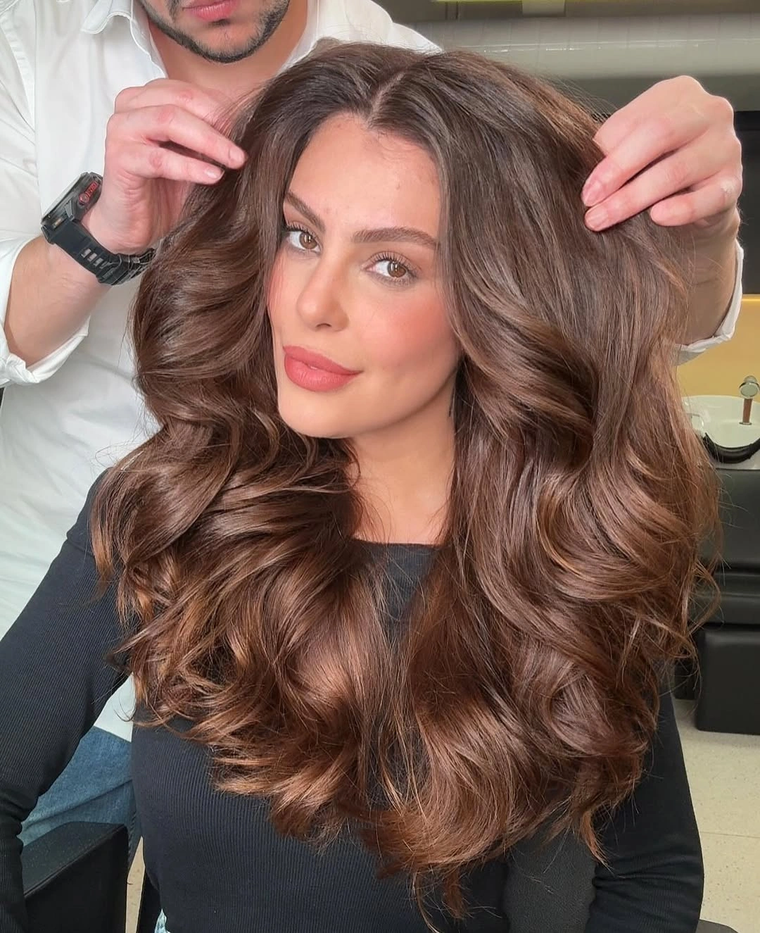 Long chocolate brown hair with voluminous face-framing curls
