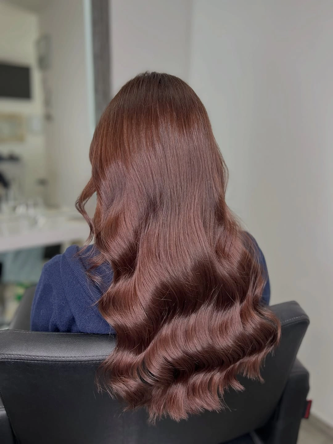 Long muted rose brown hair with smooth crown and glossy waves