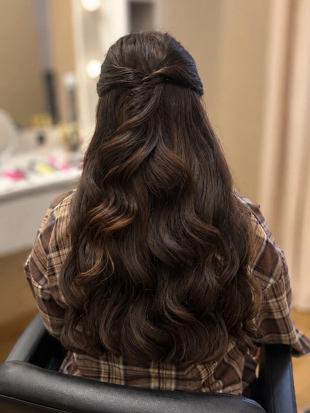 Long brunette waves with softly gathered half-up center detail