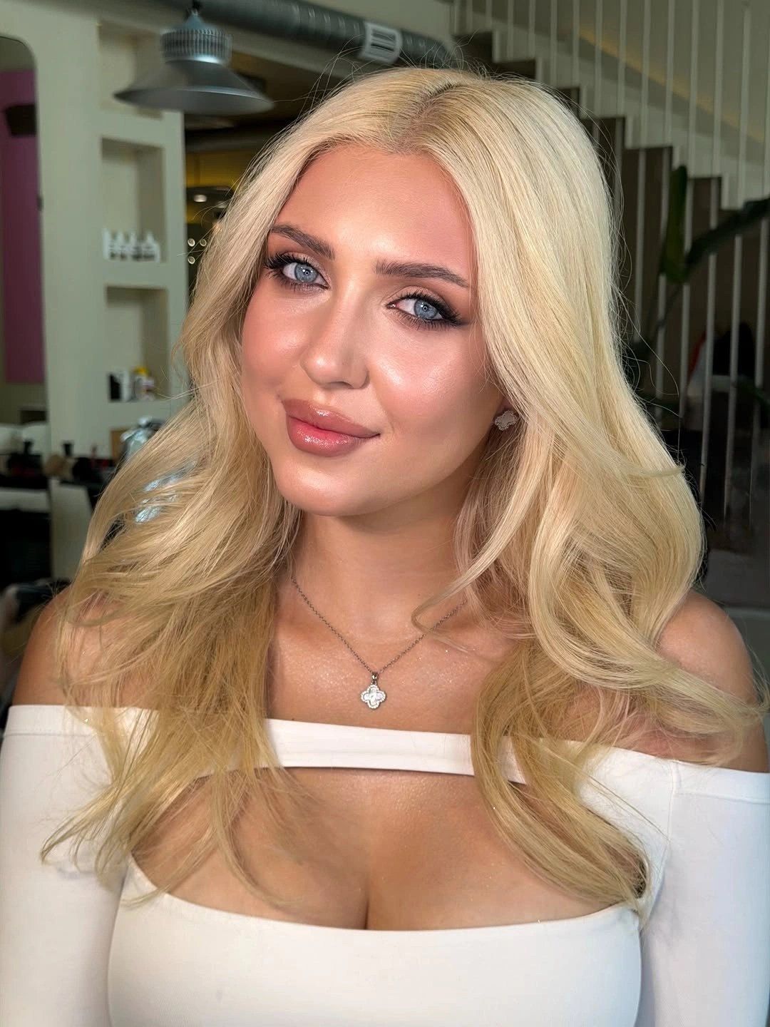 Very light blonde hair with smooth crown and soft lower bends
