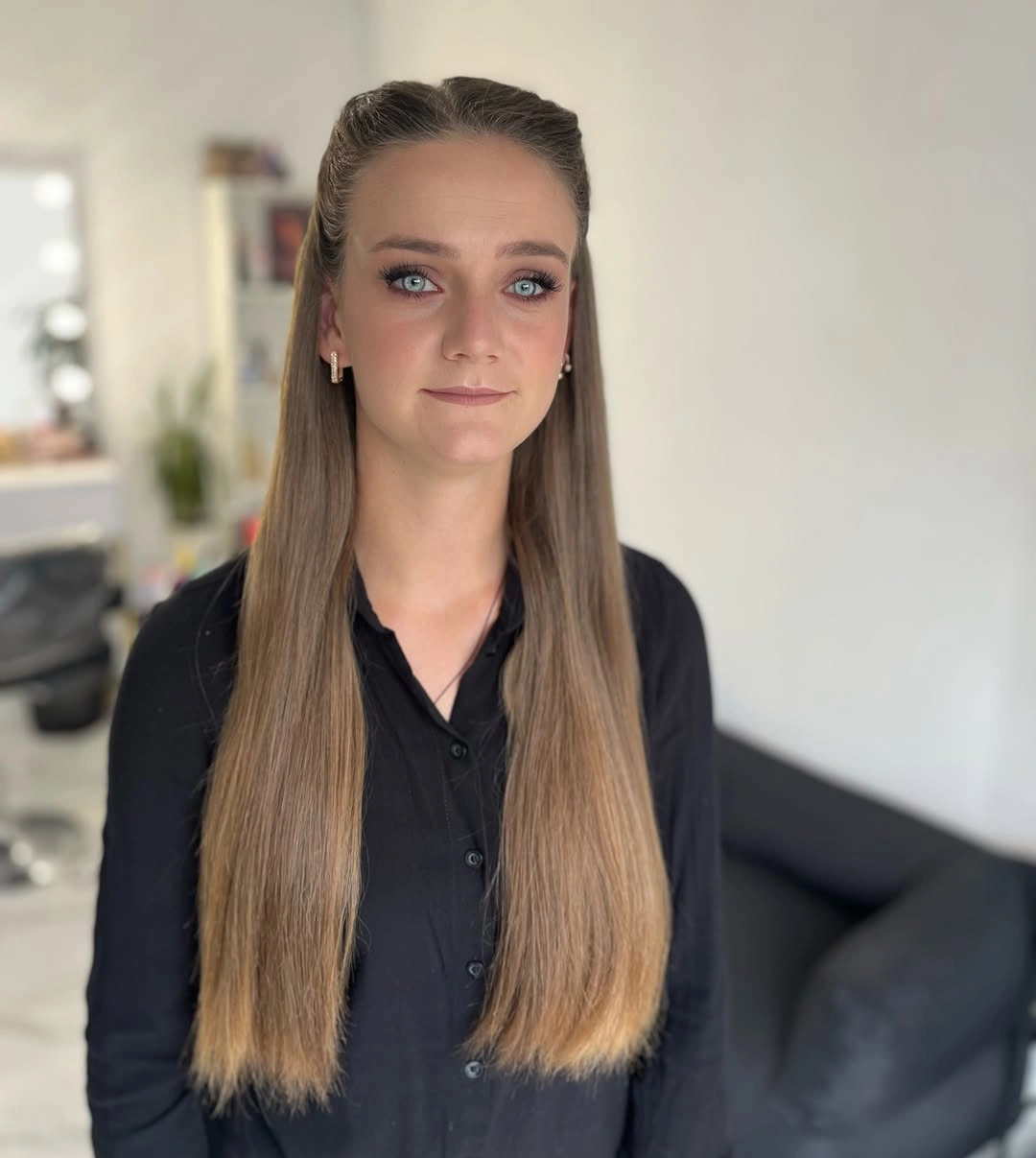 Very long straight light-brown hair with upper sides pulled back