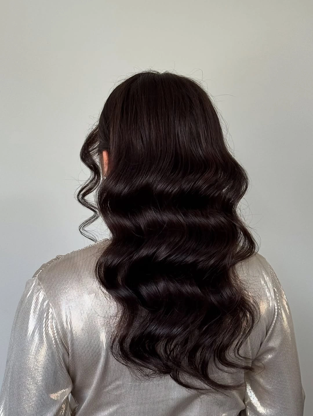 Long dark hair with large glossy S-shaped waves