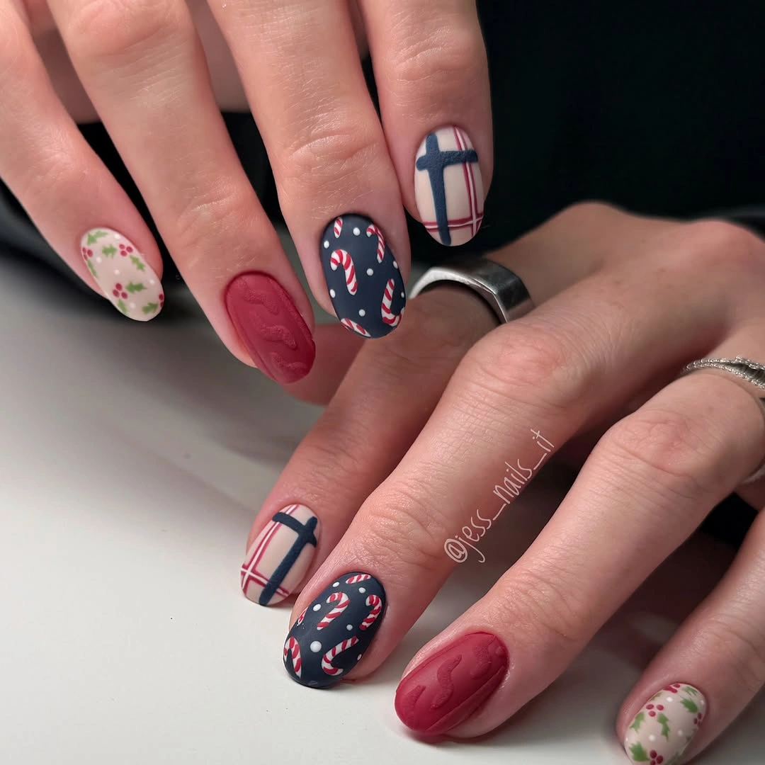 Short oval nails with plaid, candy canes, burgundy patterns, and floral sprigs