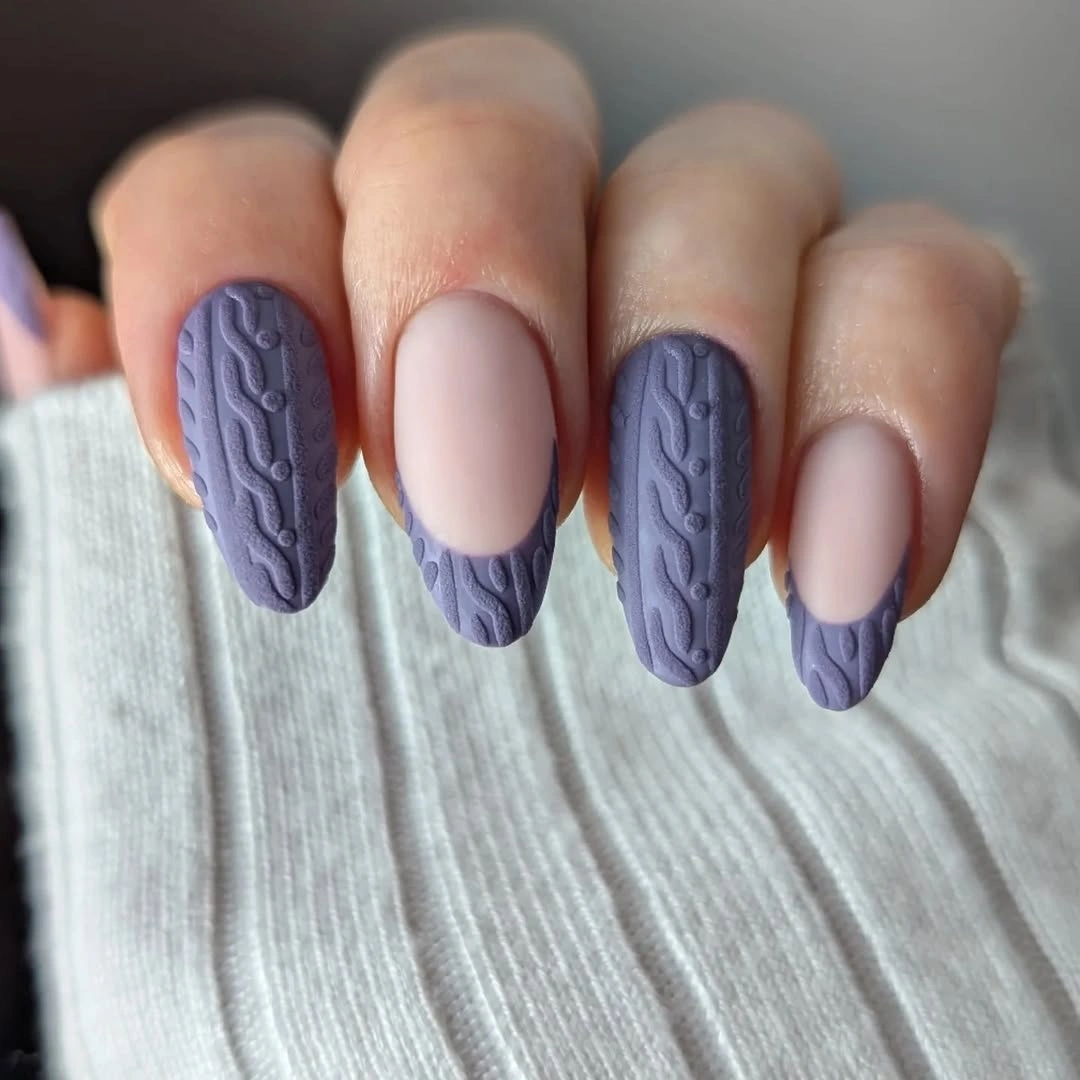 Matte lavender almond nails with raised cable patterns and textured French tips