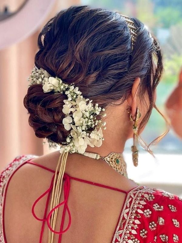 Chignon With Braided Accents And Flowers — Easy Wedding Hairstyles for Long Hair