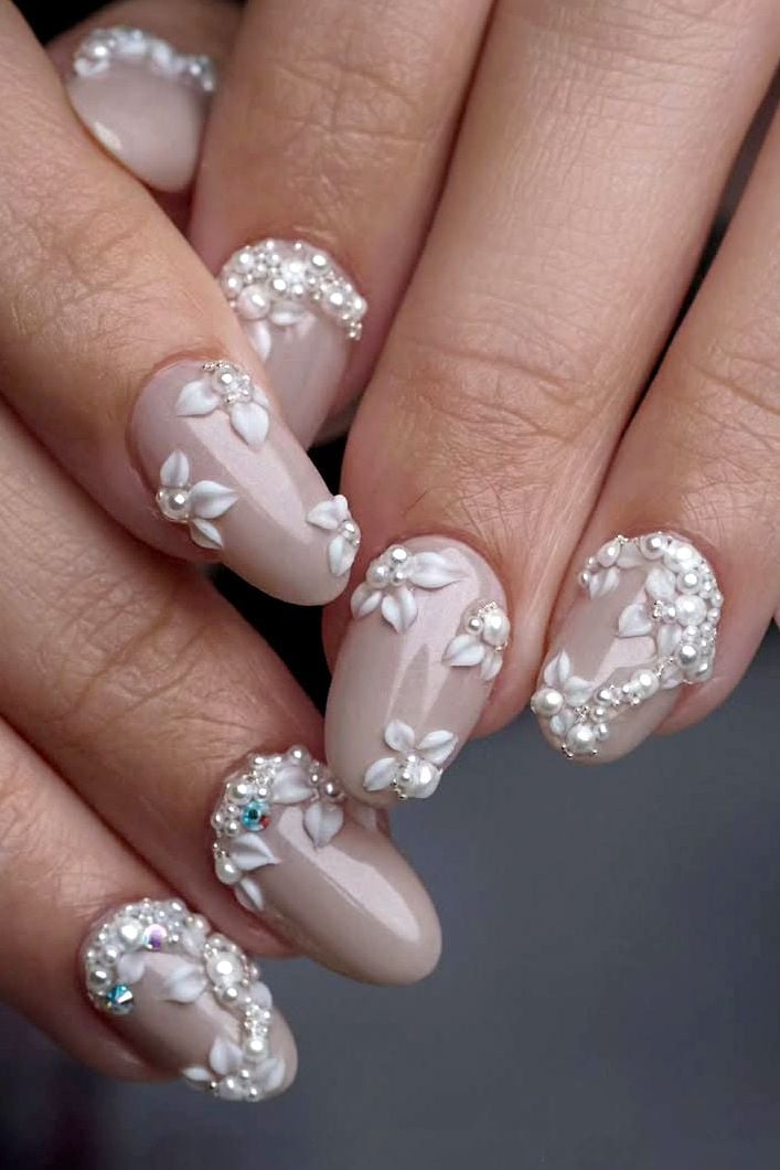 Nude Oval Nails with Dense 3D Floral, Pearl, and Rhinestone — Elegant Bridal Nails