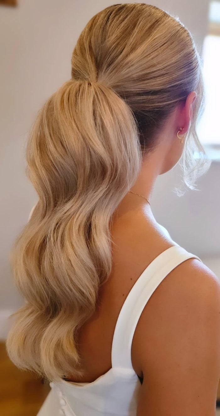 Long Blonde Ponytail With Flowing Glossy Waves Long Blonde Ponytail With Flowing Glossy Waves — Elegant Low Ponytail Hairstyles