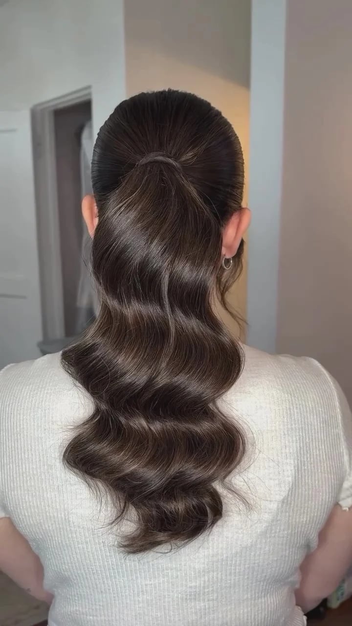 Mid-Back Dark Brown Ponytail With Polished Waves Mid-Back Dark Brown Ponytail With Polished Waves — Elegant Low Ponytail Hairstyles