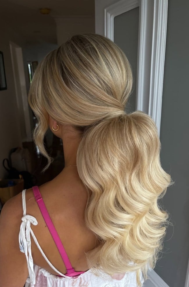 Voluminous Blonde Ponytail With Face-Framing Strands Voluminous Blonde Ponytail With Face-Framing Strands — Elegant Low Ponytail Hairstyles