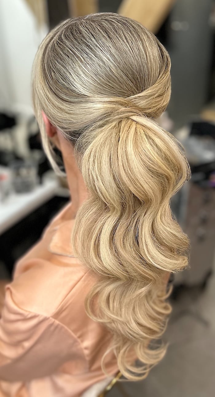 Mid-Back Blonde Ponytail With Twisted Base and Soft Waves Mid-Back Blonde Ponytail With Twisted Base and Soft Waves — Elegant Low Ponytail Hairstyles