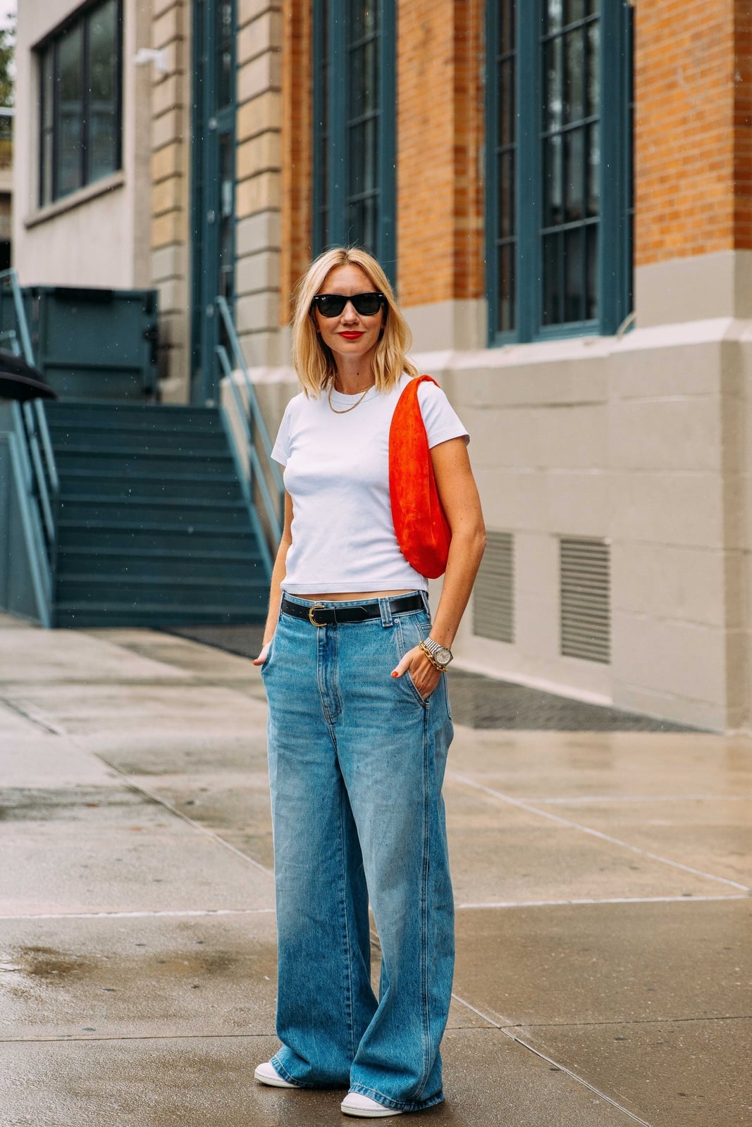 White Tee with Oversized Blue Jeans and Orange Bag White Tee with Oversized Blue Jeans and Orange Bag — Elegant Tshirt Outfit