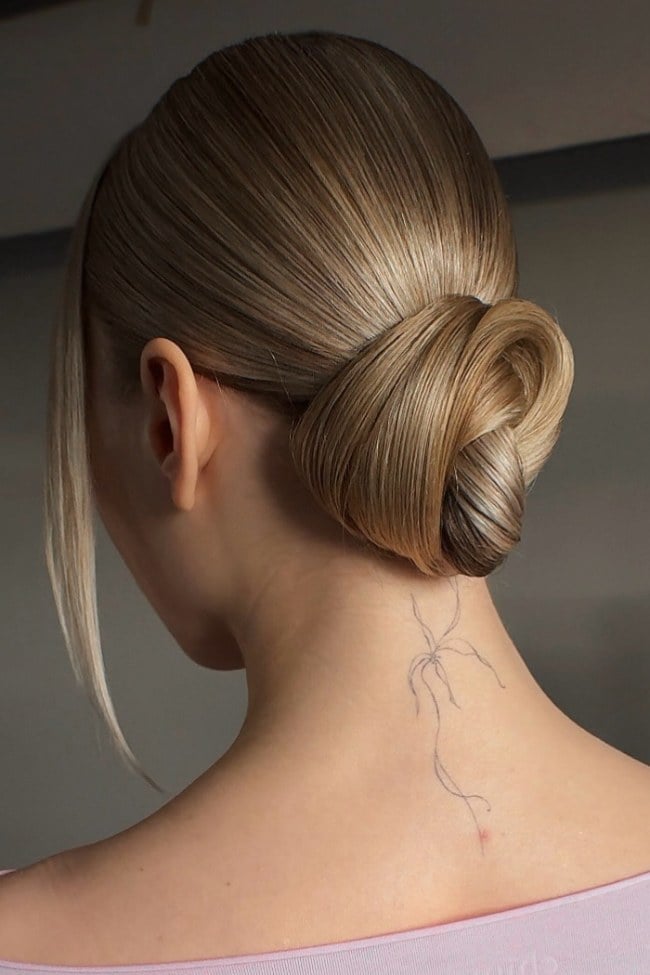 30 Timeless Wedding Hairstyles : Sleek Sculpted Low Knot Updo for Modern Elegant Hair