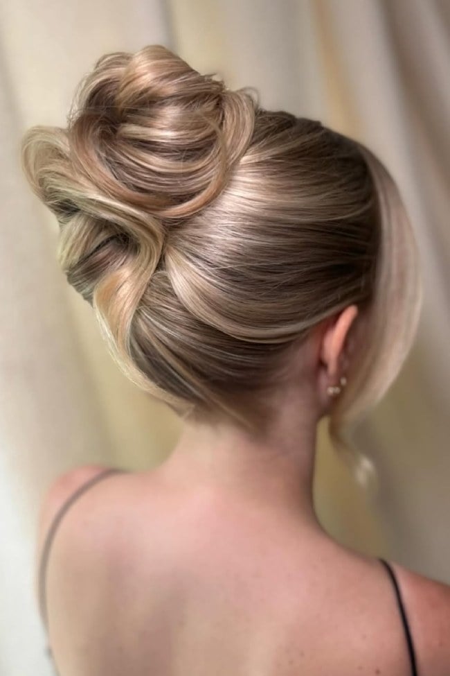 Sculpted Blonde Bun With Artistic Twists — Elegant Updo Inspo