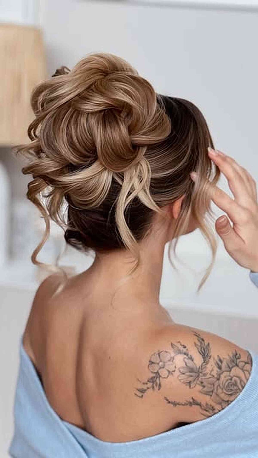 Intricate Textured Blonde Bun With Loose Tendrils — Elegant Updo Inspo