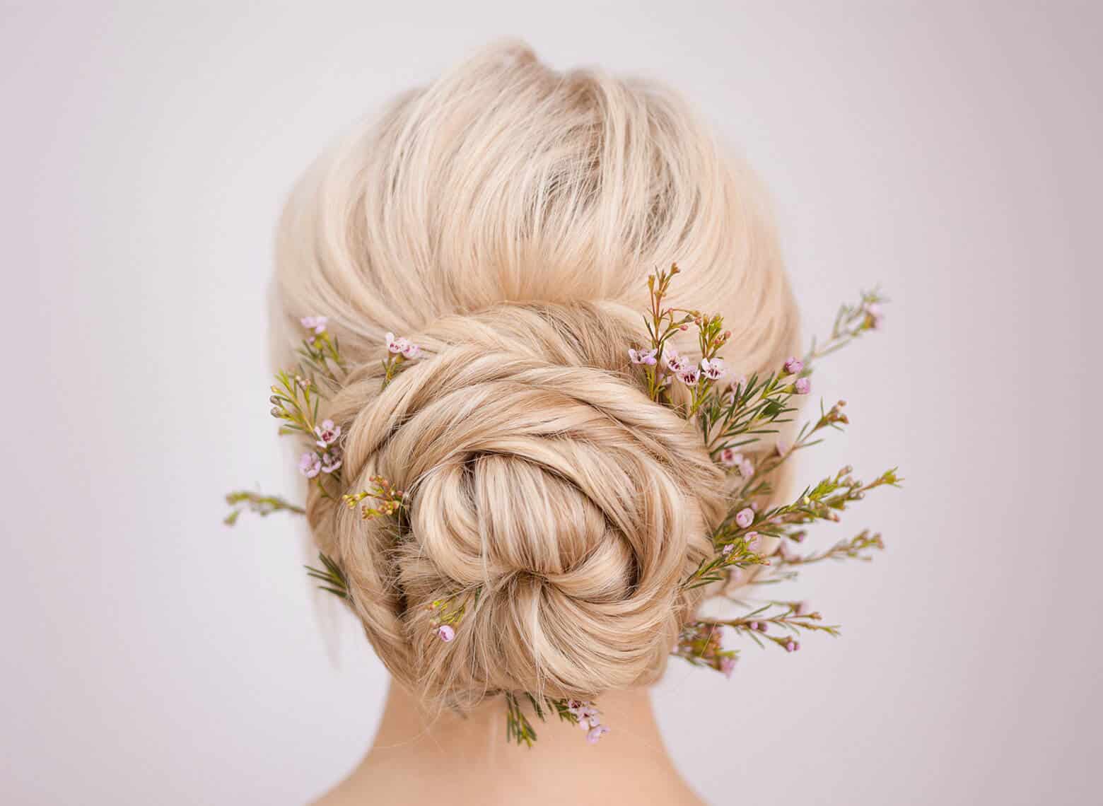 Braided Platinum Blonde Bun With Floral Accents — Elegant Updo Inspo