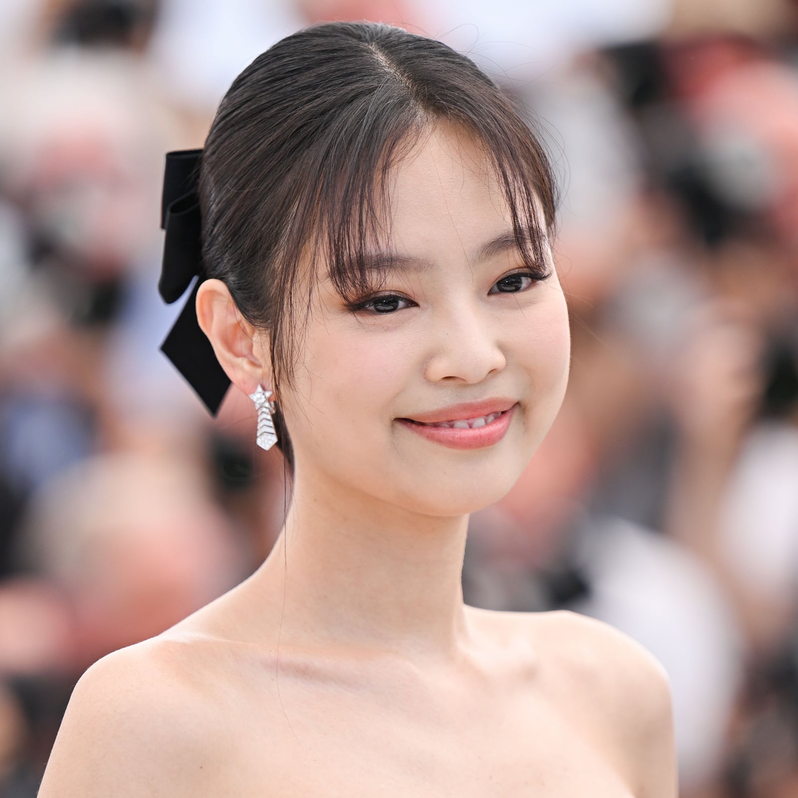 Dark Brown Updo With Soft Curtain Bangs And Bow — Elegant Updo Inspo