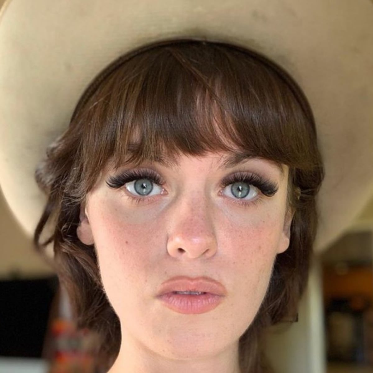 Shoulder-Length Medium Brown Shag With Full Bangs — Hair Ideas with Hat