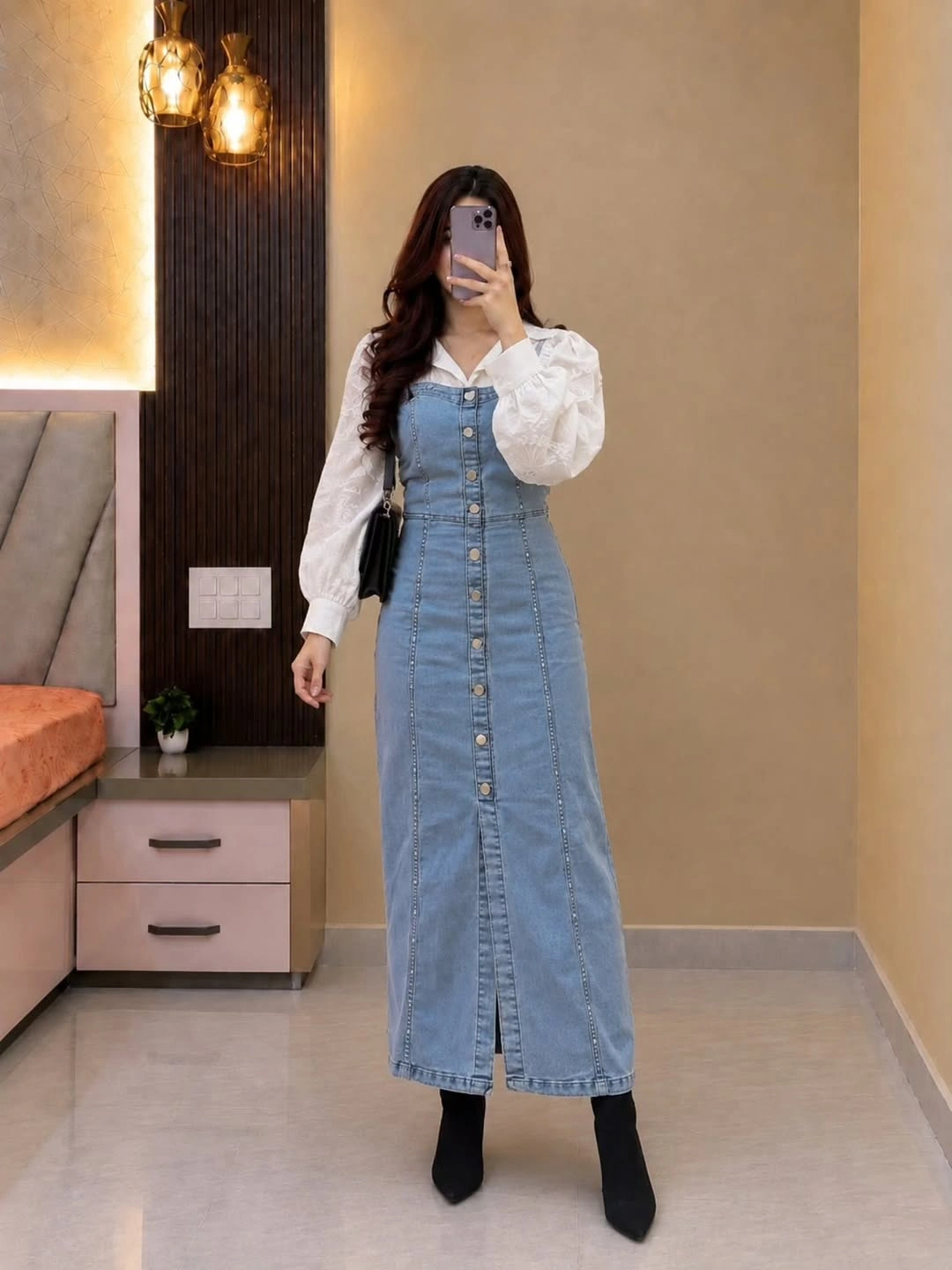 Blue button-front denim dress over white puff-sleeve blouse with black boots