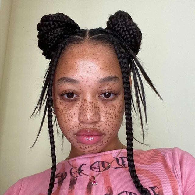 Double Braided Buns With Loose Strands Double Braided Buns With Loose Strands — Natural Hair Braiding Ideas