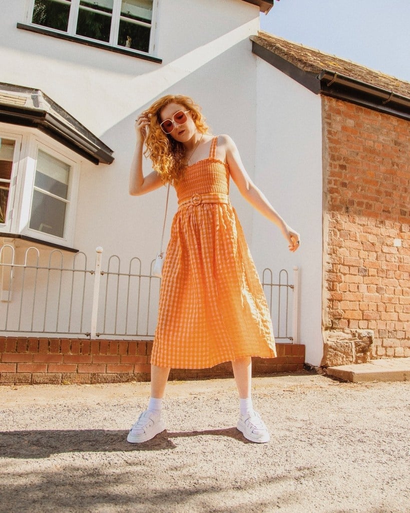 Orange and White Gingham Midi Dress with Belted Waist, Close-Up Take Orange and White Gingham Midi Dress with Belted Waist, Close-Up Take — Orange Dress Ideas