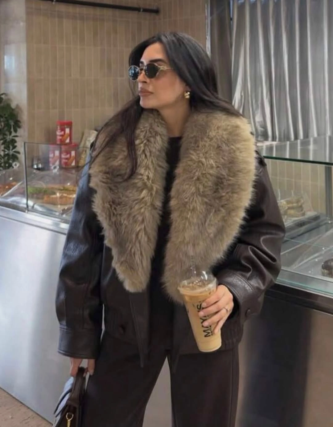 Dark brown oversized jacket with large light taupe collar sunglasses and handbag