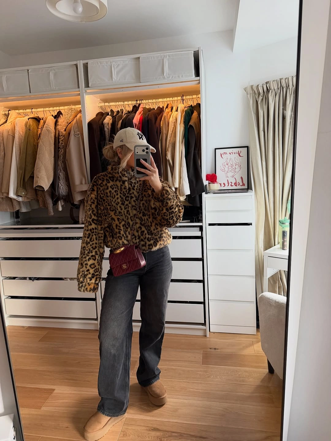 Leopard patterned jacket charcoal wide leg jeans pale cap and burgundy bag