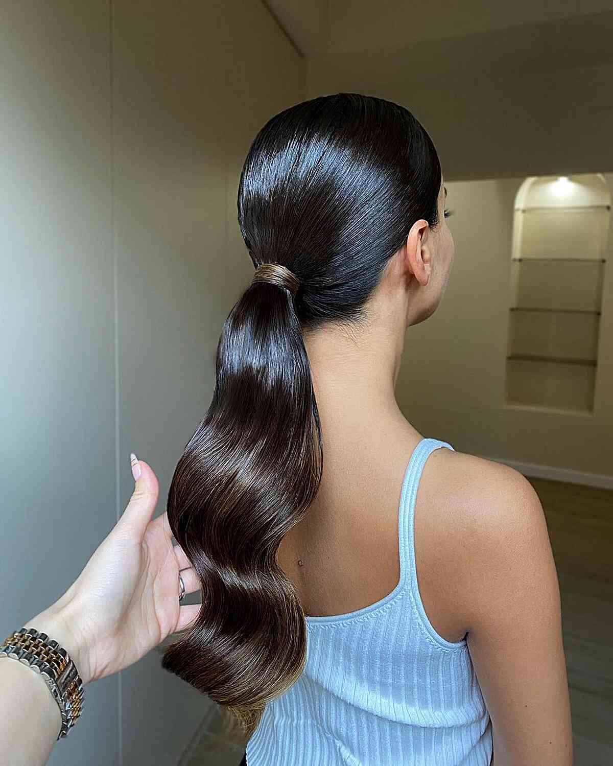 Sleek Dark Brown Ponytail With Glossy Waves Sleek Dark Brown Ponytail With Glossy Waves — Quick Weave Ponytail Ideas