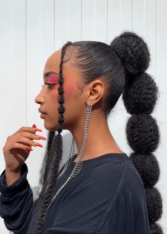 Mid-Back Ponytail With Stacked Afro Puffs Mid-Back Ponytail With Stacked Afro Puffs — Quick Weave Ponytail Ideas