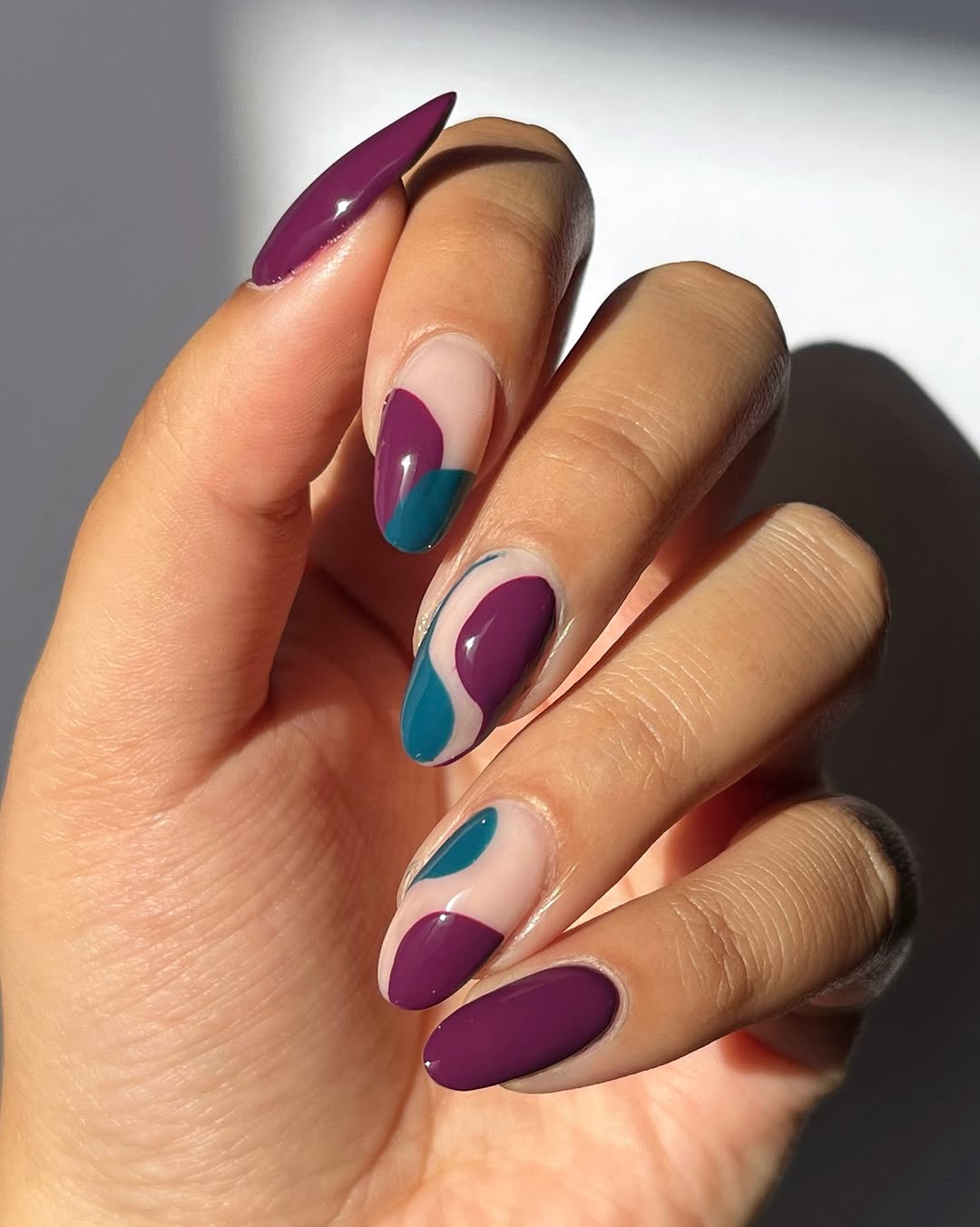 Nude Almond With Abstract Purple And Teal Shapes Nude Almond With Abstract Purple And Teal Shapes — Simple Almond Nails