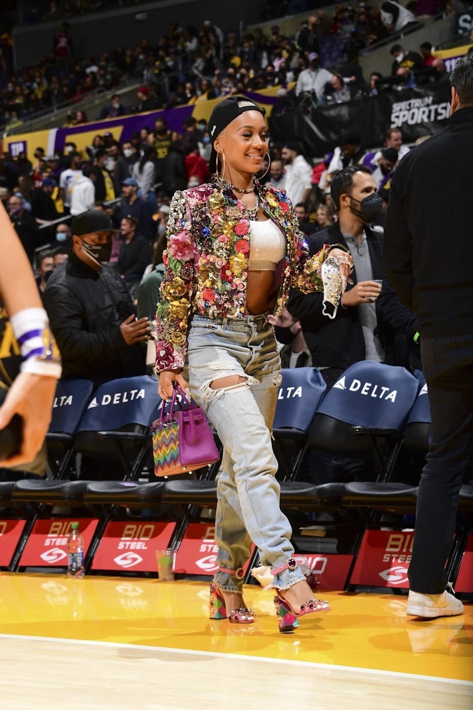 Sequined Jacket Over Bra Top and Ripped Jeans Sequined Jacket Over Bra Top and Ripped Jeans — Simple Basketball Game Outfits