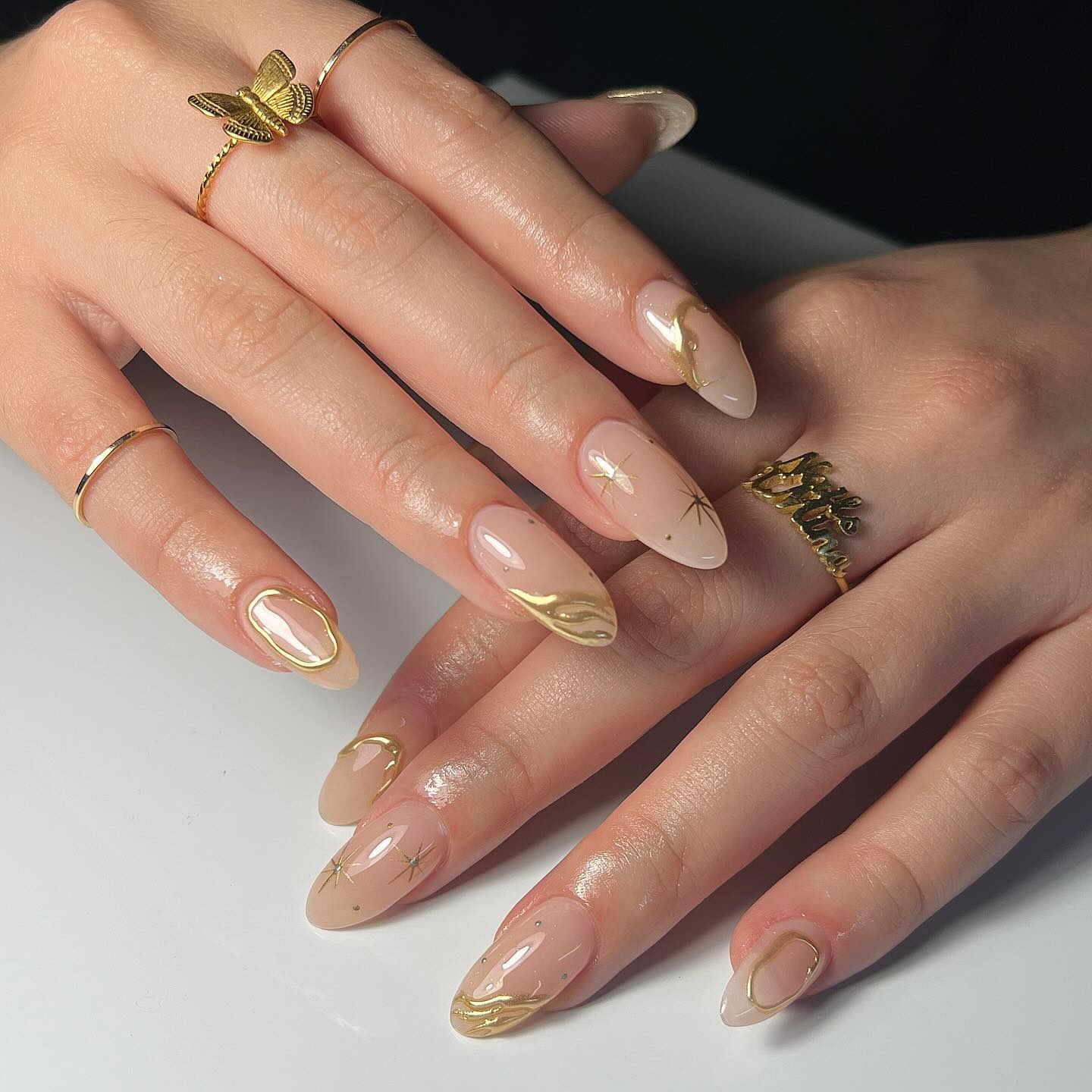 Medium Almond Gold Foil Swirls Stars Medium Almond Gold Foil Swirls Stars — Simple Birthday Nails Almond