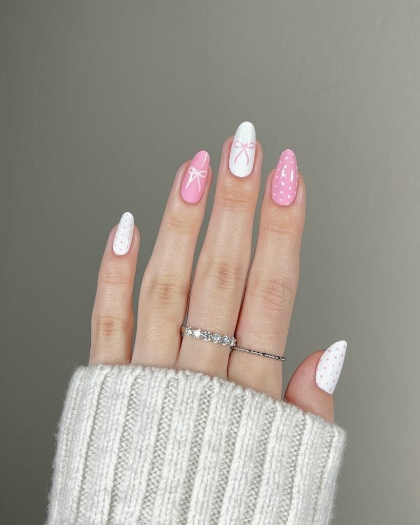 Short Pink White Polka Dot Bow Almond Nails, Close-Up Take Short Pink White Polka Dot Bow Almond Nails, Close-Up Take — Simple Birthday Nails Almond