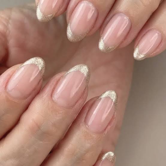 Sheer Nude Gold Glitter French Tip Medium Oval Nails Sheer Nude Gold Glitter French Tip Medium Oval Nails — Simple Champagne Nails