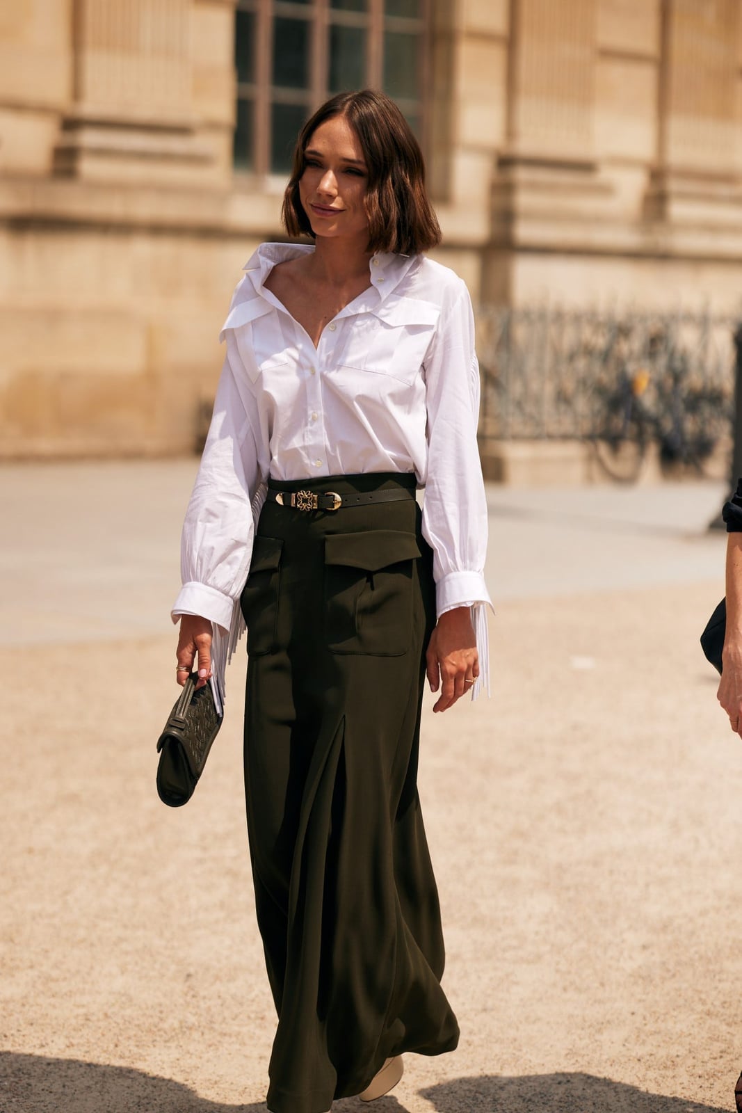 Black Sweater Vest Over Pleated Midi Skirt with Logo Belt Black Sweater Vest Over Pleated Midi Skirt with Logo Belt — Simple Corporate Outfits for Women