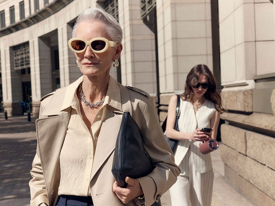 Beige Trench Coat Over Cream Blouse and Dark Trousers Beige Trench Coat Over Cream Blouse and Dark Trousers — Simple Corporate Outfits for Women