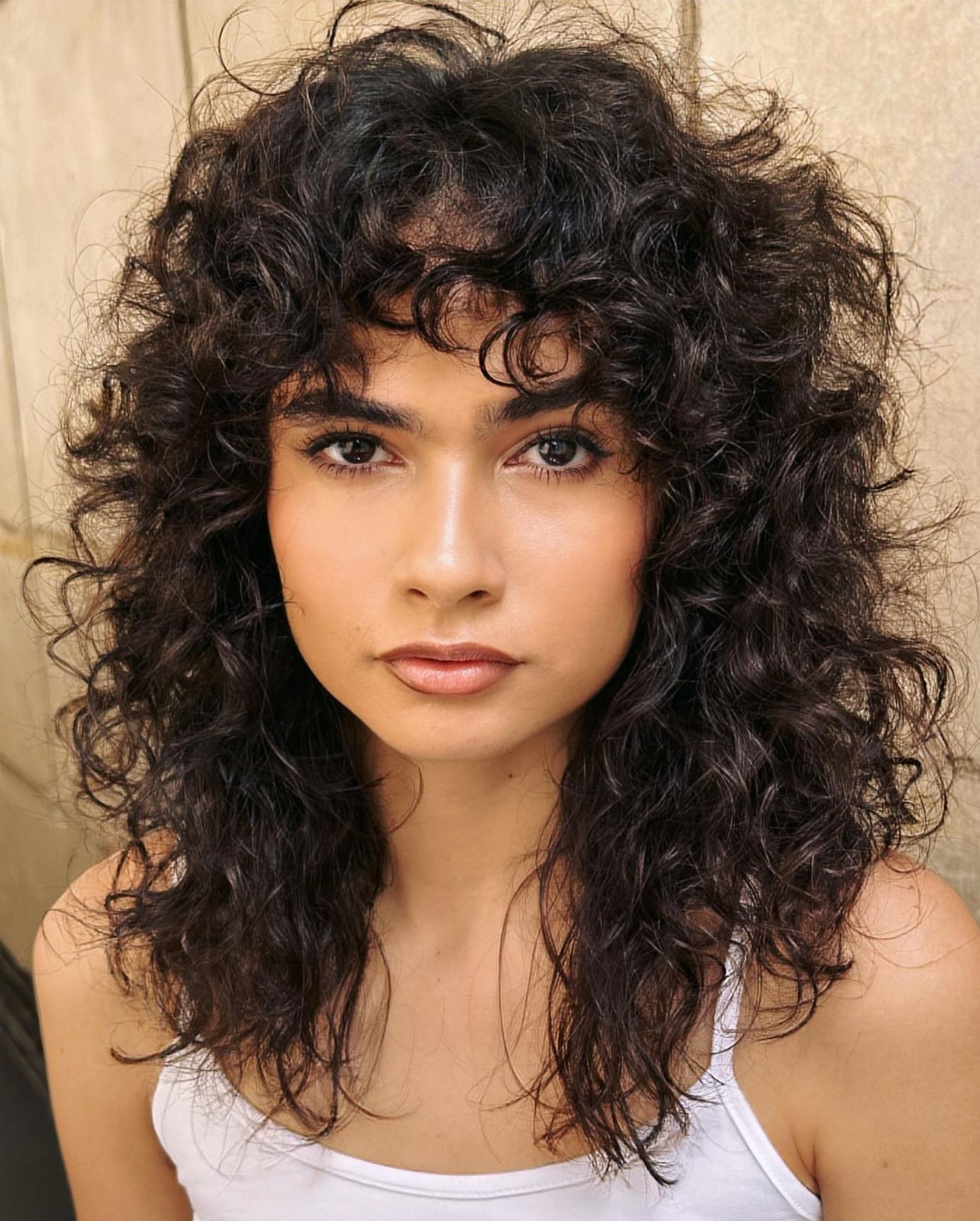Collarbone Layers With Full Curly Bangs Collarbone Layers With Full Curly Bangs — Simple Curly Bangs