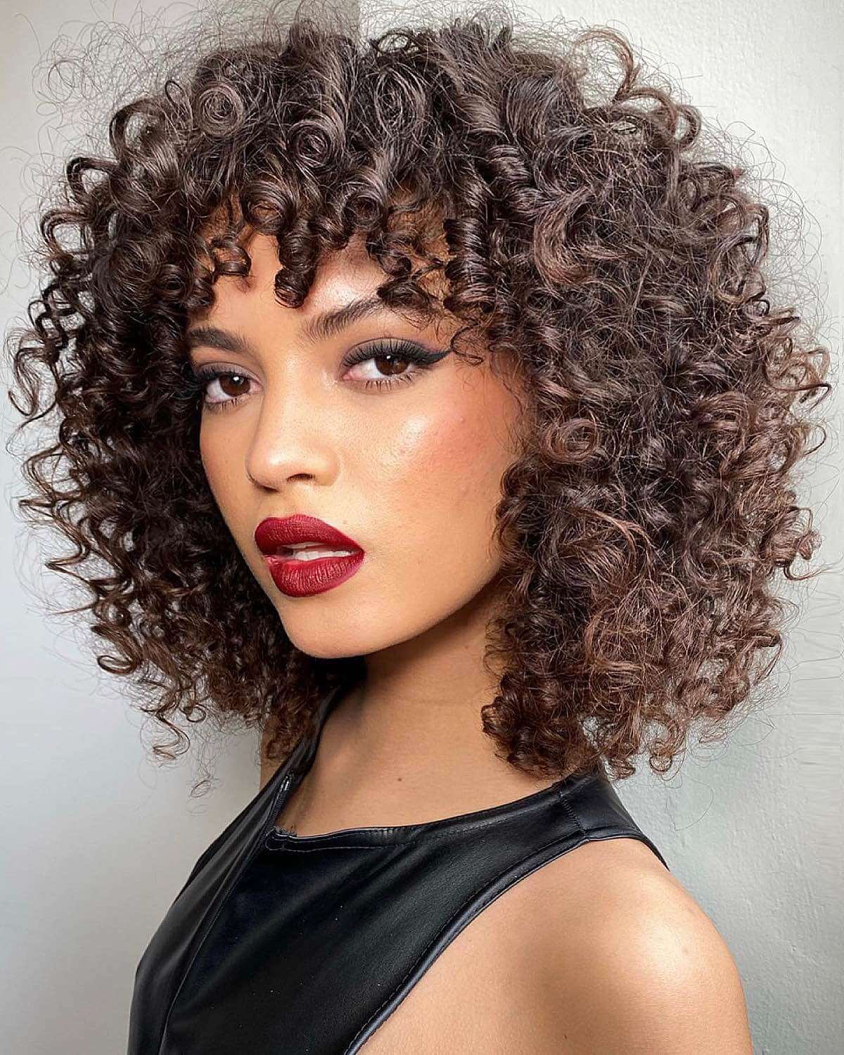 Chin Length Bob With Full Curly Bangs Chin Length Bob With Full Curly Bangs — Simple Curly Bangs