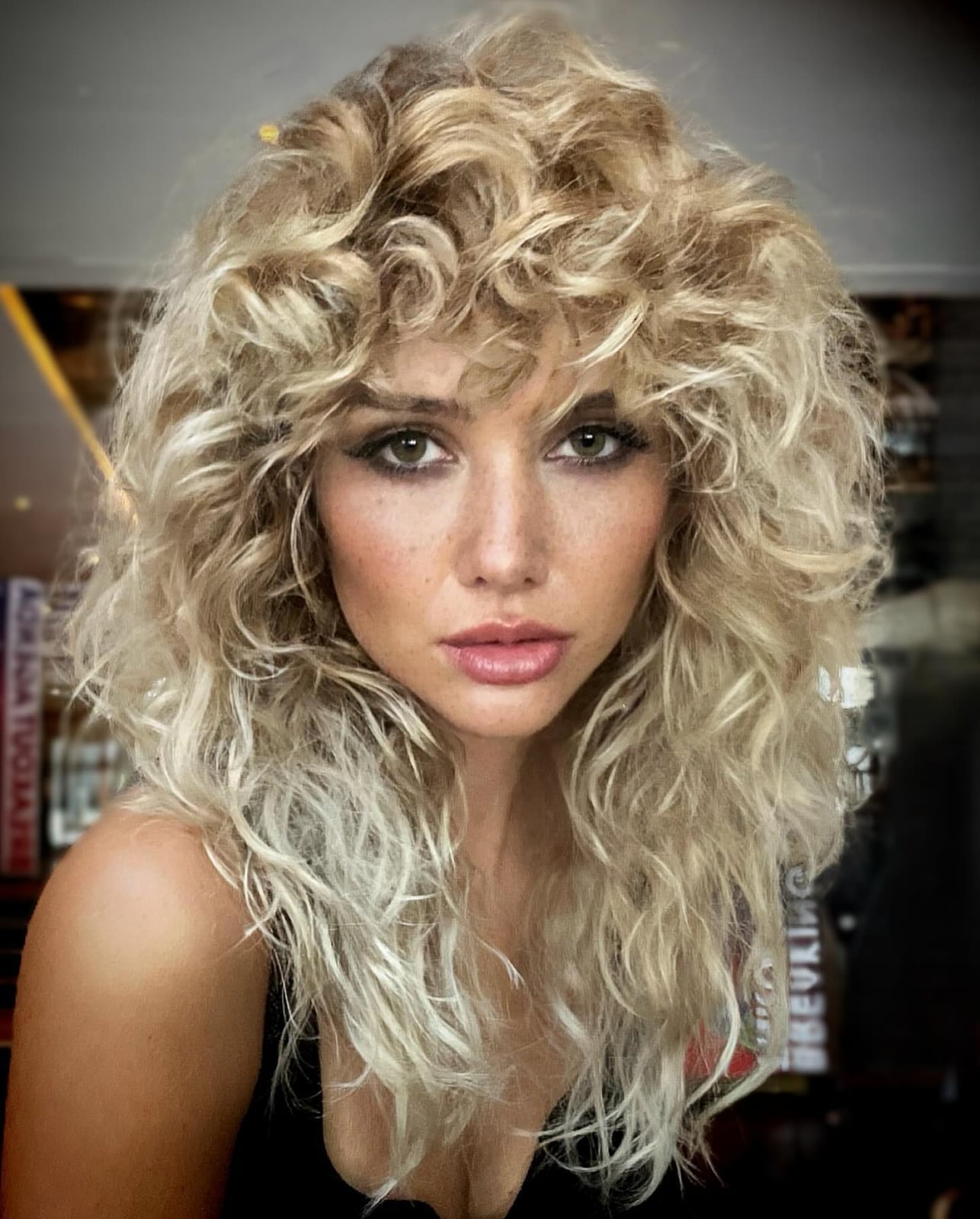 Platinum Blonde Shag With Curtain Bangs — Simple Curly Shag