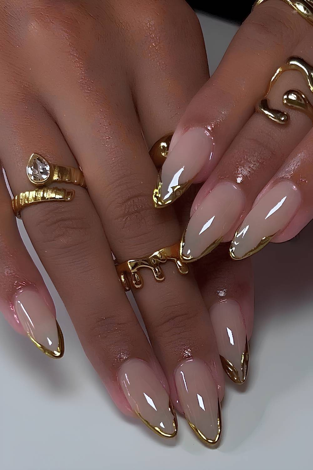Almond Nude Base Thin Gold Chrome French, Close-Up Take Almond Nude Base Thin Gold Chrome French, Close-Up Take — Simple Gold Chrome Nails