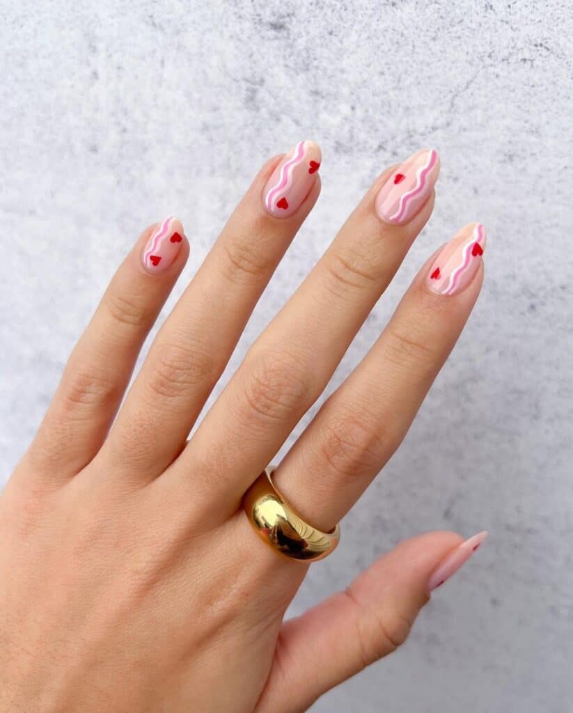 Medium Almond Nude Nails with Pink Wavy Lines and Red Hearts — Simple Kawaii Nails