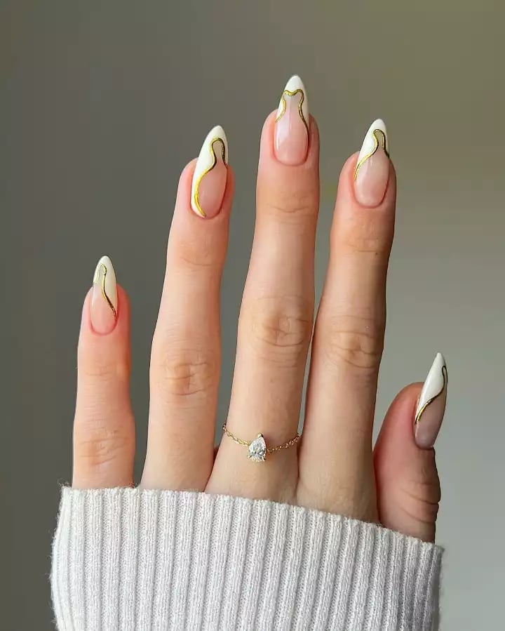 Long Almond Nails With Gold Line French Tips Long Almond Nails With Gold Line French Tips — Simple Nail Art Inspo