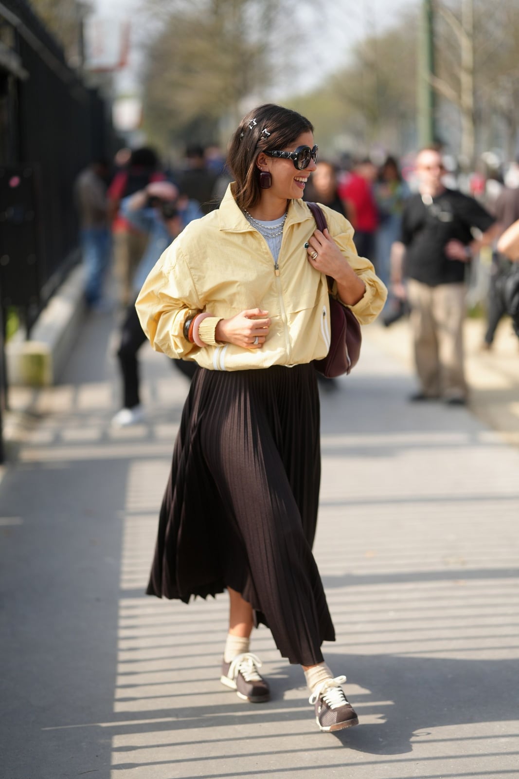 Dark Brown Pleated Maxi Skirt with a Track Jacket, Close-Up Take — Simple Pleated Skirt Outfits