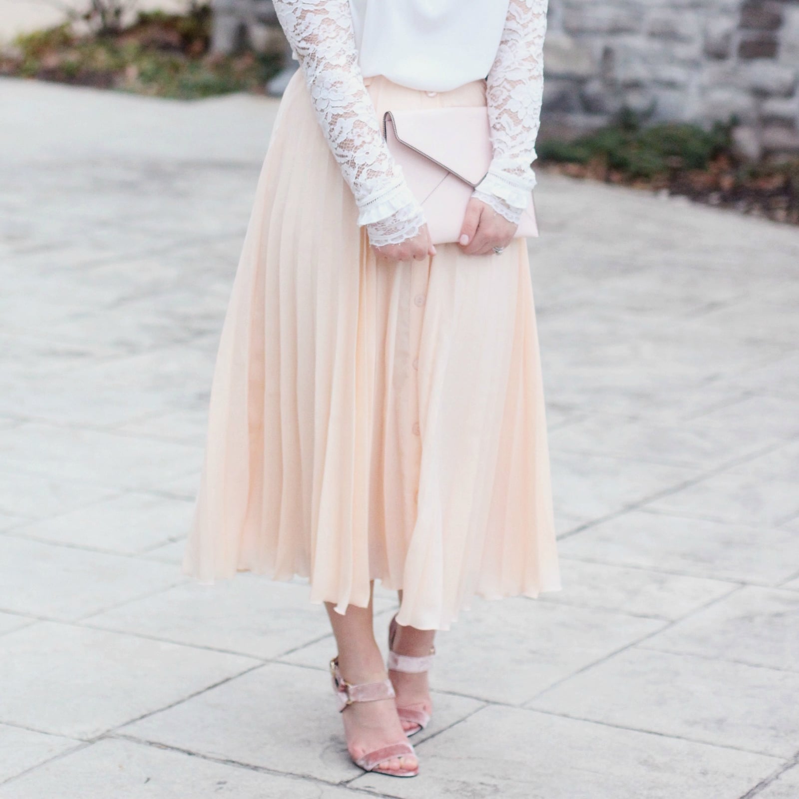 Pale Peach Pleated Midi Skirt with a Lace Top and Pink Envelope Clutch — Simple Pleated Skirt Outfits