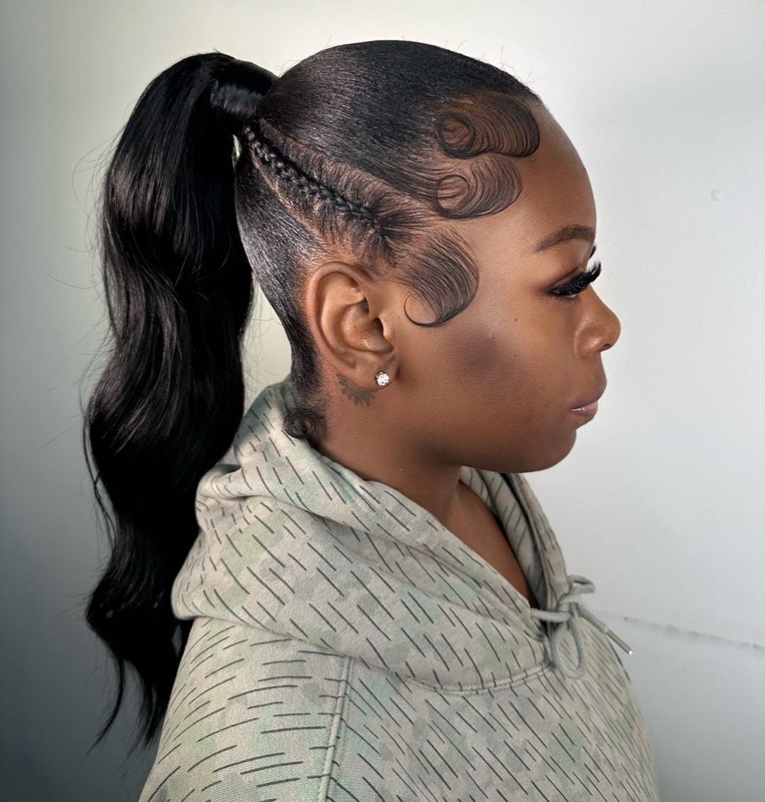 Wavy Black Ponytail With Subtle Shine — Slick Back Ponytail Ideas