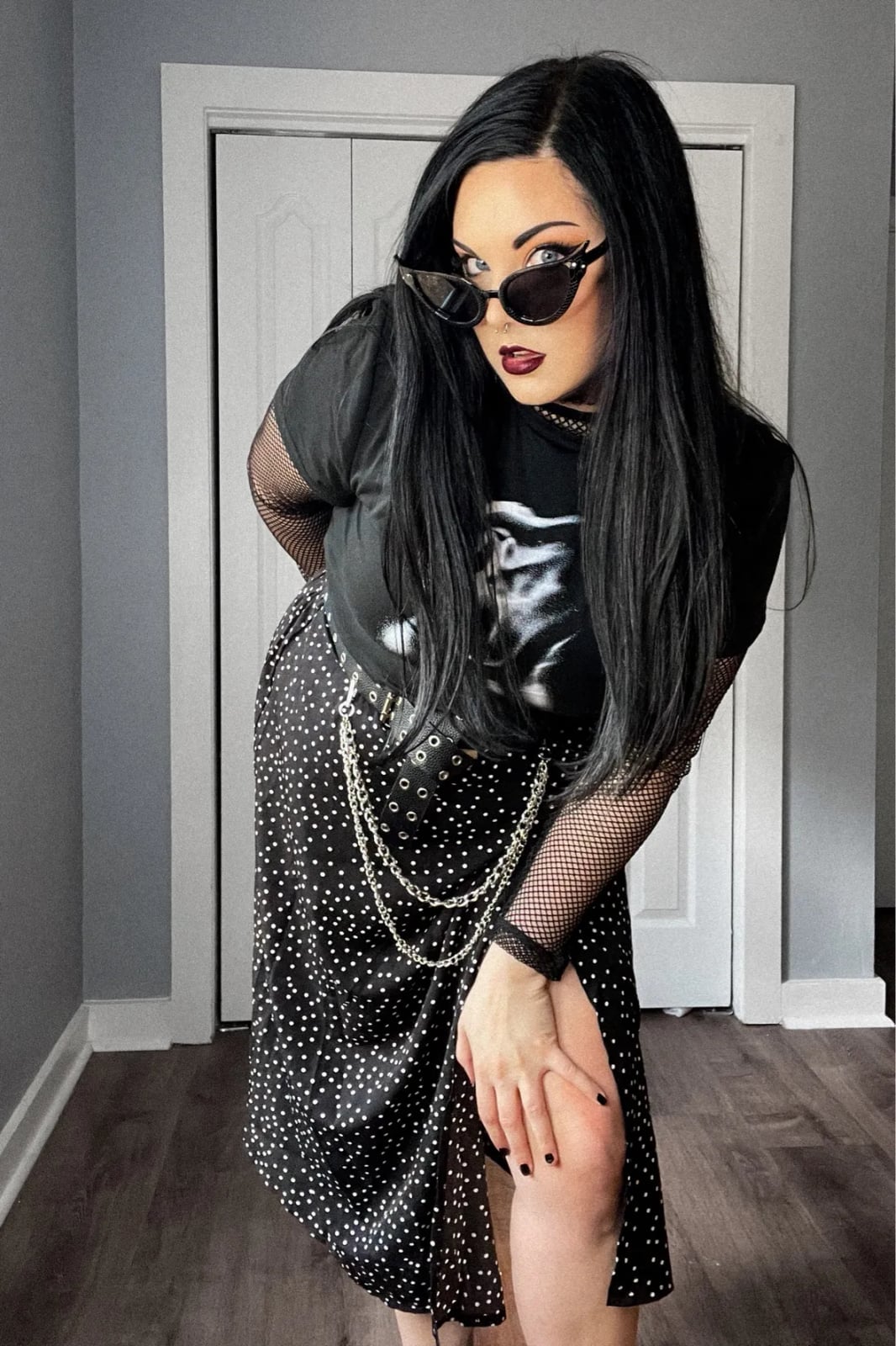 Graphic Tee Over Fishnet Top with Polka Dot Skirt Graphic Tee Over Fishnet Top with Polka Dot Skirt — Trendy Alt Outfits