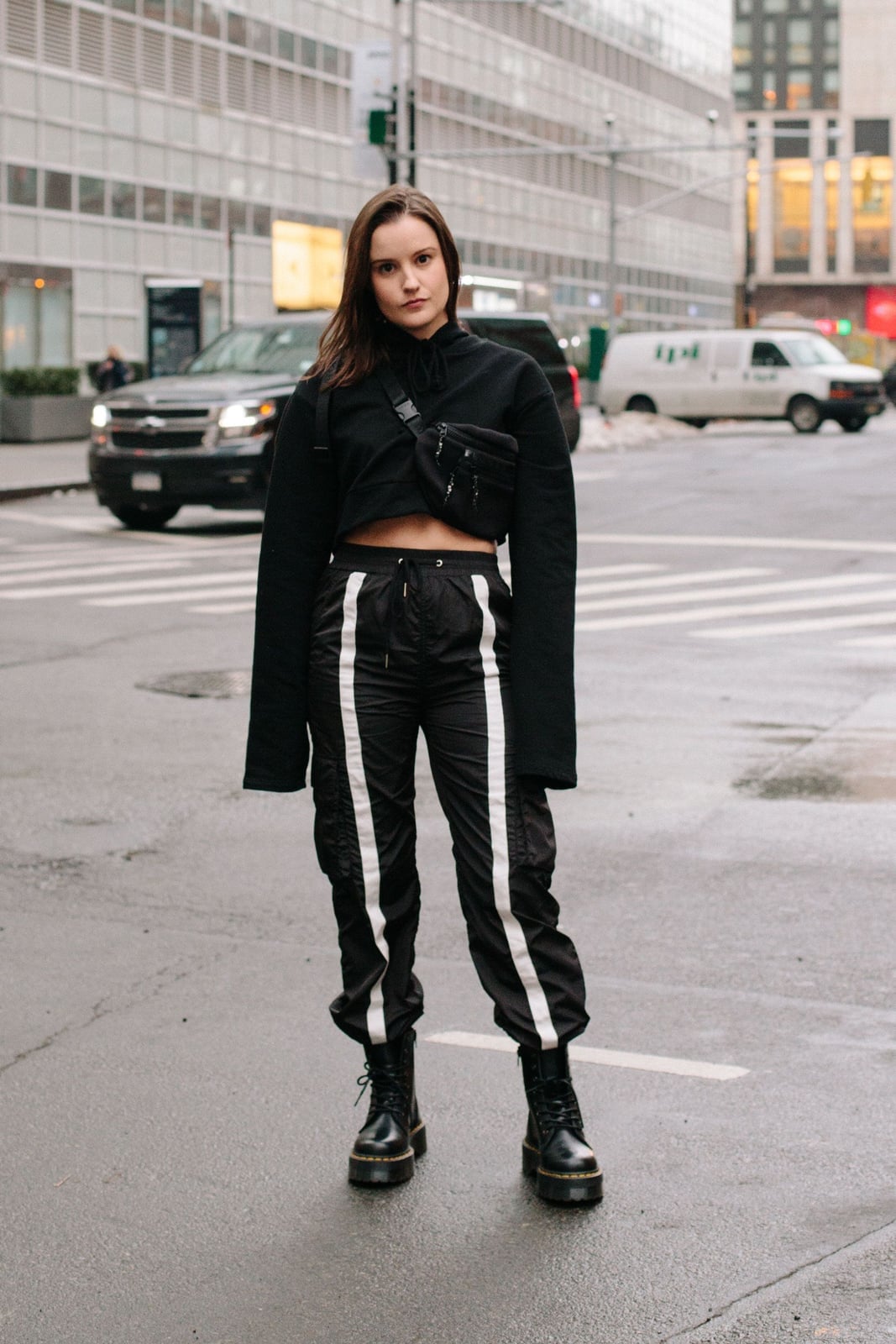 Black Cropped Sweatshirt with Striped Track Pants and Combat Boots — Trendy Athleisure Outfits