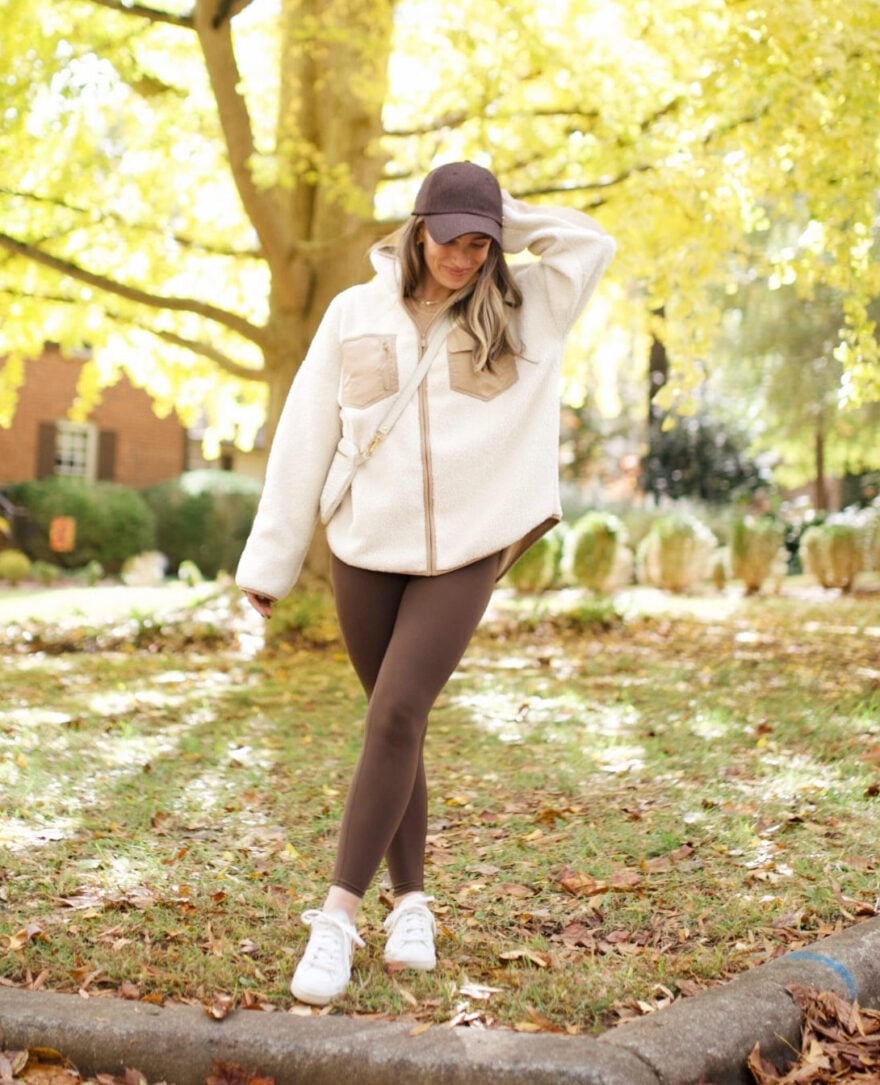 Cream Fleece Jacket with Brown Leggings and Cap — Trendy Athleisure Outfits