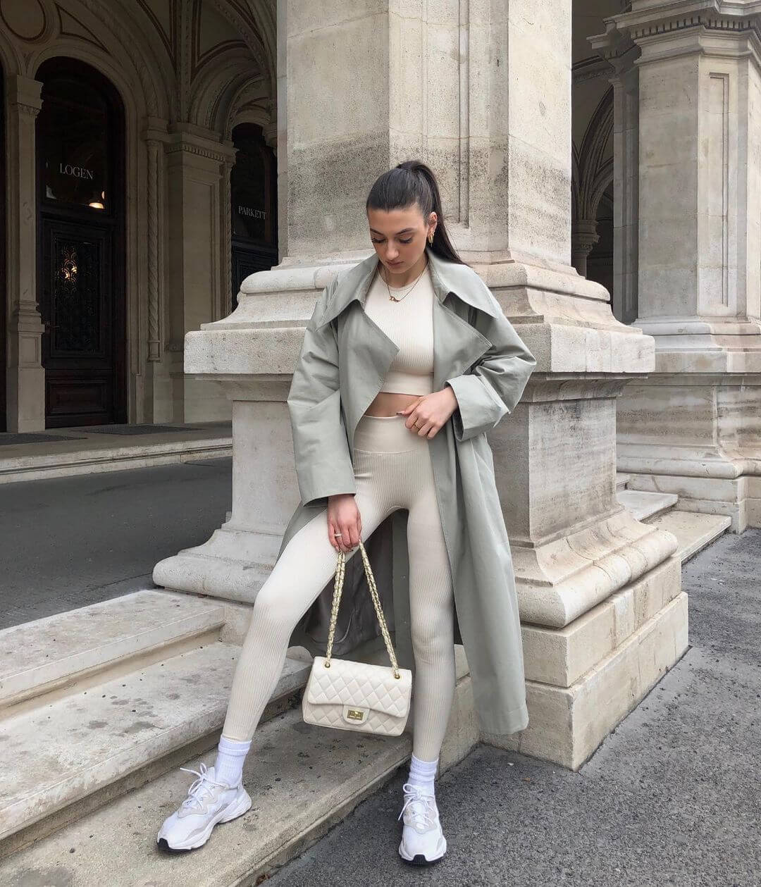 Trench Coat Over Cream Crop Top and Leggings — Trendy Athleisure Outfits