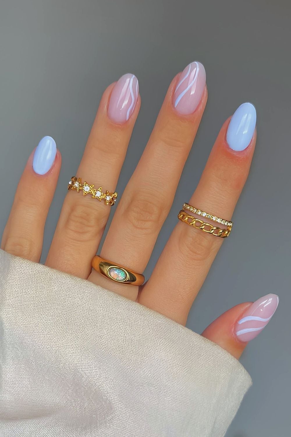 Soft Baby Blue Sheer Pink Wavy Line Medium Almond Nails Soft Baby Blue Sheer Pink Wavy Line Medium Almond Nails — Trendy Baby Blue Nails